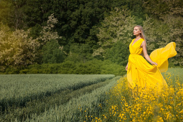 Blonde girl in a yellow dress.