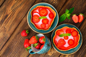 Layered dessert with fruits, cream cheese and jelly in wafer