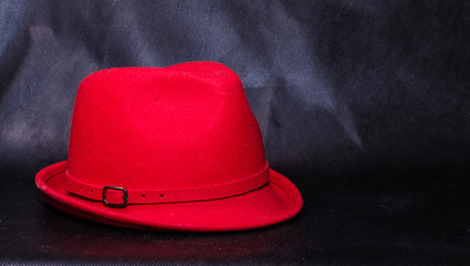Vintage red hat isolated on black background