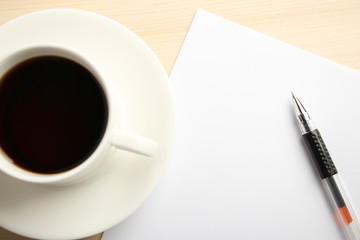Blank paper with ball pen and coffee