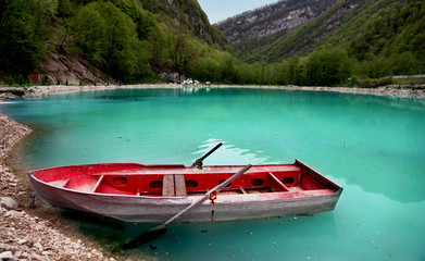 Naklejka na ściany i meble Boat on turquoise lake