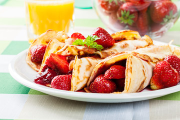 Traditional crepes served with strawberries