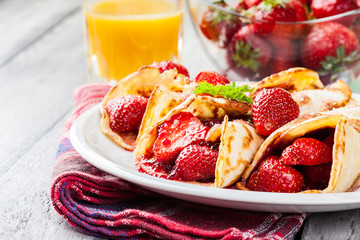 Traditional crepes served with strawberries