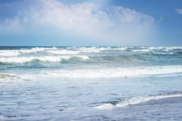 Naklejka na ściany i meble Beautiful sea landscape. The waves breaking on a beach.