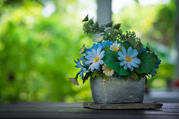 Blue flowers in stone vase