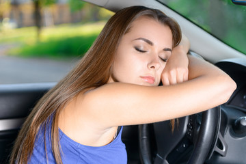 Fototapeta na wymiar Pleasant lady sleeping in car