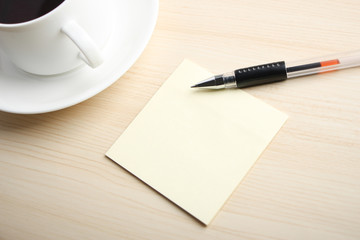 Blank note with ball pen and coffee