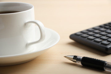 Pen calculator and coffee