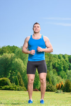 Muscled sportsman during training