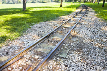 Fototapeta premium Detail of a little tramway in an urban park of Wien - Austria