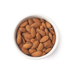 Bowl full of almond seeds isolated