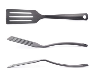Used black plastic spatula isolated
