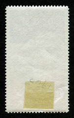 Reverse side of a postage stamp.