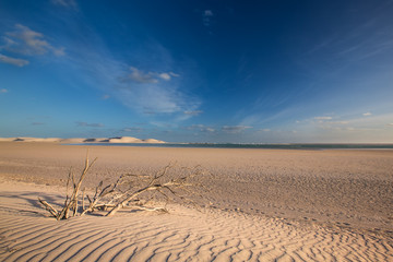 Fototapeta na wymiar Glorious sand dune in the distance over empty tidal lagoon