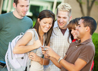 College: Friends Look At Pictures on Camera