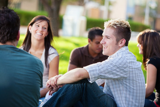 College: Guy Laughing with Friends on Campus