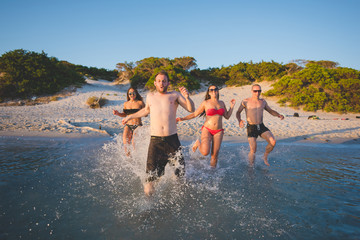 group of young multiethnic friends beach summer