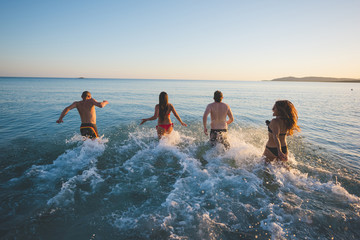 group of young multiethnic friends beach summer