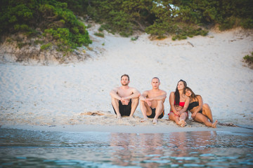 group of young multiethnic friends beach summer