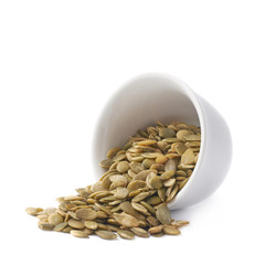 White cup filled with pumpkin seeds