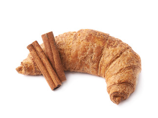 Croissant pastry and cinnamon sticks
