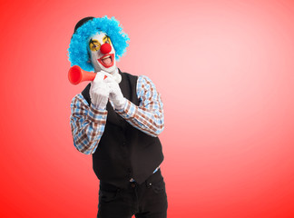 Fototapeta na wymiar portrait of a funny clown with a whistle