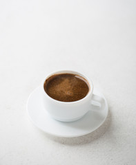 Cup of coffee on old rustic  table.