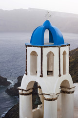 Traditional blue and white church in Oia, Santorini island, Greece