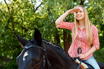 Girl looking ahead on the horse