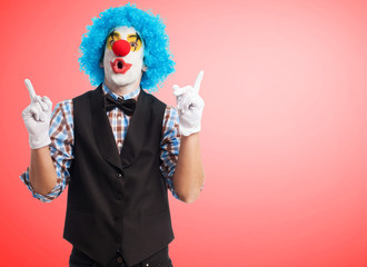 portrait of a clown smiling over white background