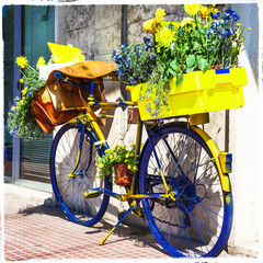Fototapeta na wymiar Bicycle of postman -charming street decoration