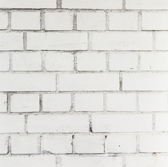  white painted bricks at an old house wall