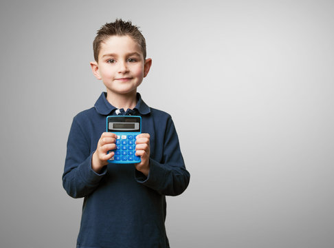little kid using calculator - Powered by Adobe