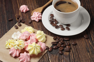 Meringue cookies and coffee cup