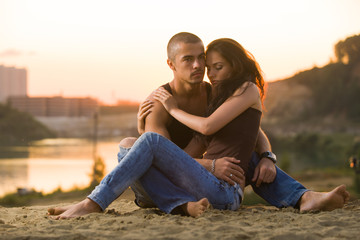 Couple in jeans on the beach