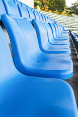 Fototapeta premium Empty blue seats or chair rows in stadium