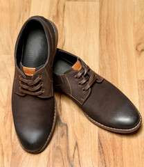 Men's shoes on a wooden background