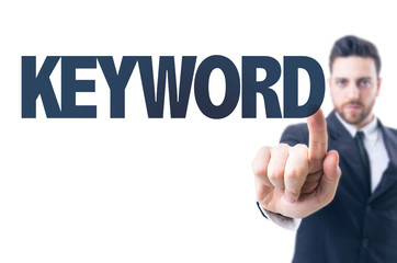Business man pointing the text: Keyword