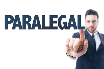 Business man pointing the text: Paralegal