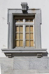 Typical portuguese window against a white wall.