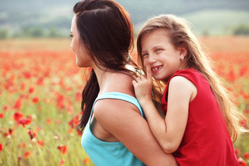 Mother with her child in sunlight