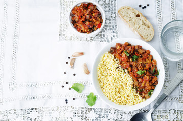buttered millet with tomato eggplant curry