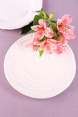 Table setting with flowers, closeup