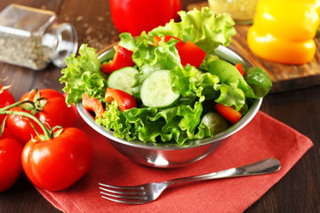 fresh vegetable salad in bowl on table close up