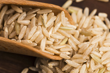 Spoon of brown rice close up