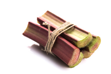 Bunch of fresh rhubarb isolated on white background