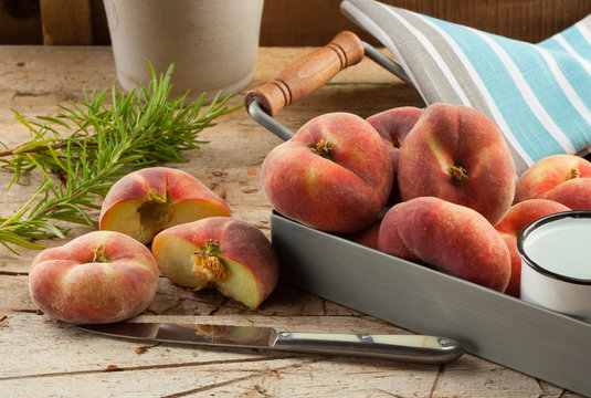 Freshly harvested saturn peaches