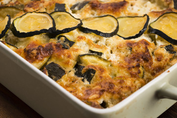 casserole with cheese and zucchini in baking dish