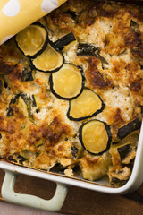 casserole with cheese and zucchini in baking dish