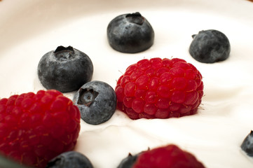 Bowl of yogurt with raspberries and blueberries